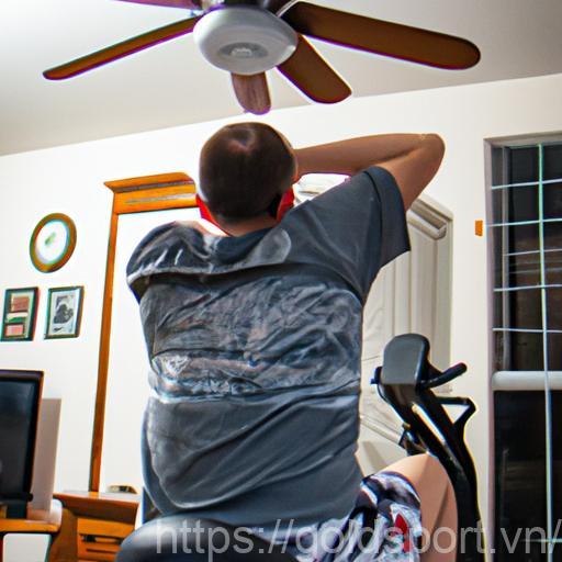 A Person Working Out In A Home Gym With A Ceiling Fan Providing A Refreshing Breeze.